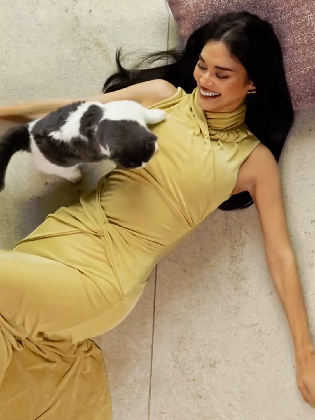 Pia Jaucey in an olive-gold halter maxi dress for Tatler Philippines editorial